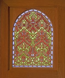 Stucco glass window with intertwined tendrils