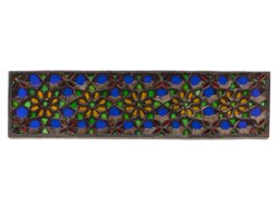 Stucco and glass window with flower and star ornamentation