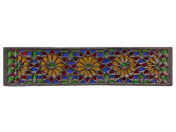 Stucco and glass window with flower and star ornamentation