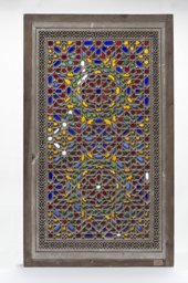 Replica of a stucco and glass window with interlaced star ornamentation