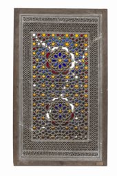 Replica of a stucco and glass window with interlaced star ornamentation