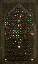 Stucco and glass window with interlaced star ornamentation