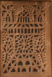 Stucco glass window with representation of a mosque